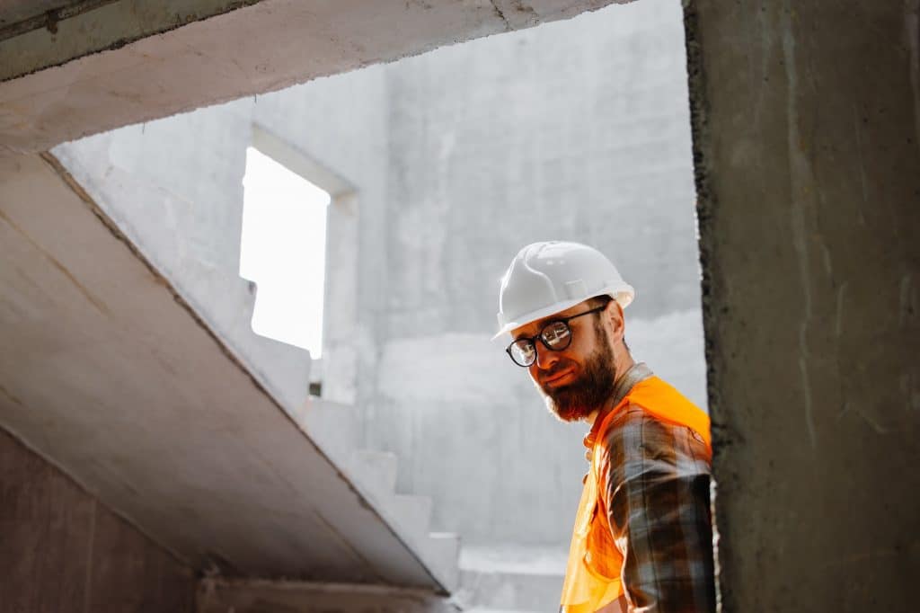 Young businessman construction standing on his workplace on the construction site