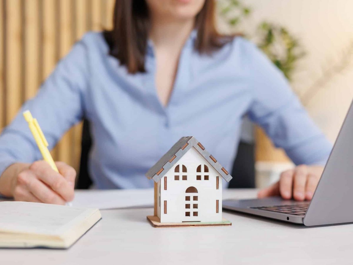 European woman buys or sells a house in a construction company. I work in the office of the company European woman buys or sells a house in a construction company. I work in the office of the company